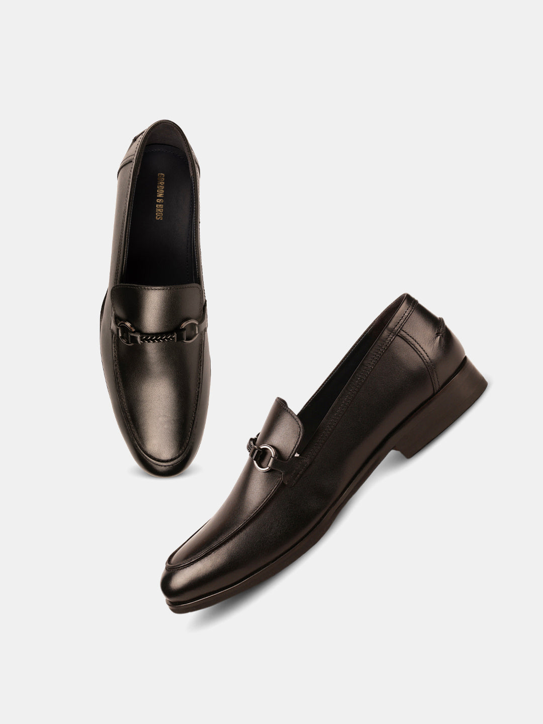 Black leather loafers for men with metal bit detailing and glossy finish — elegant slip-on formal shoes - With White Background