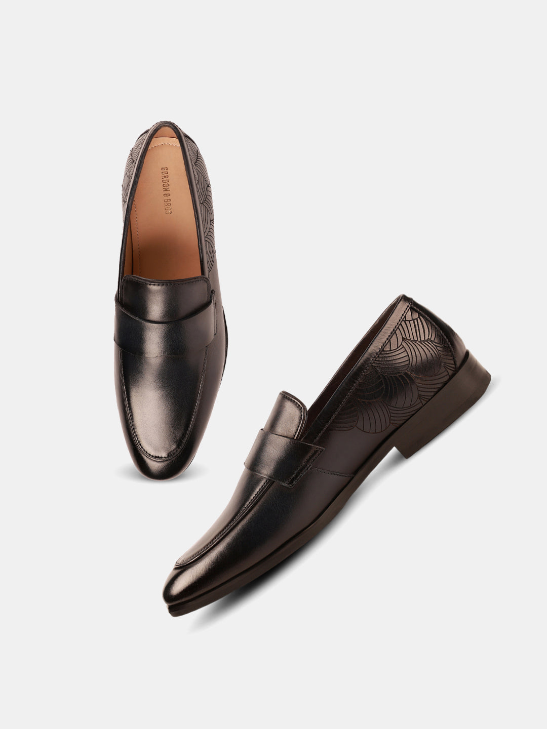 A pair of navy-colored classic leather loafers with a lace-up closure and a contrasting sole.