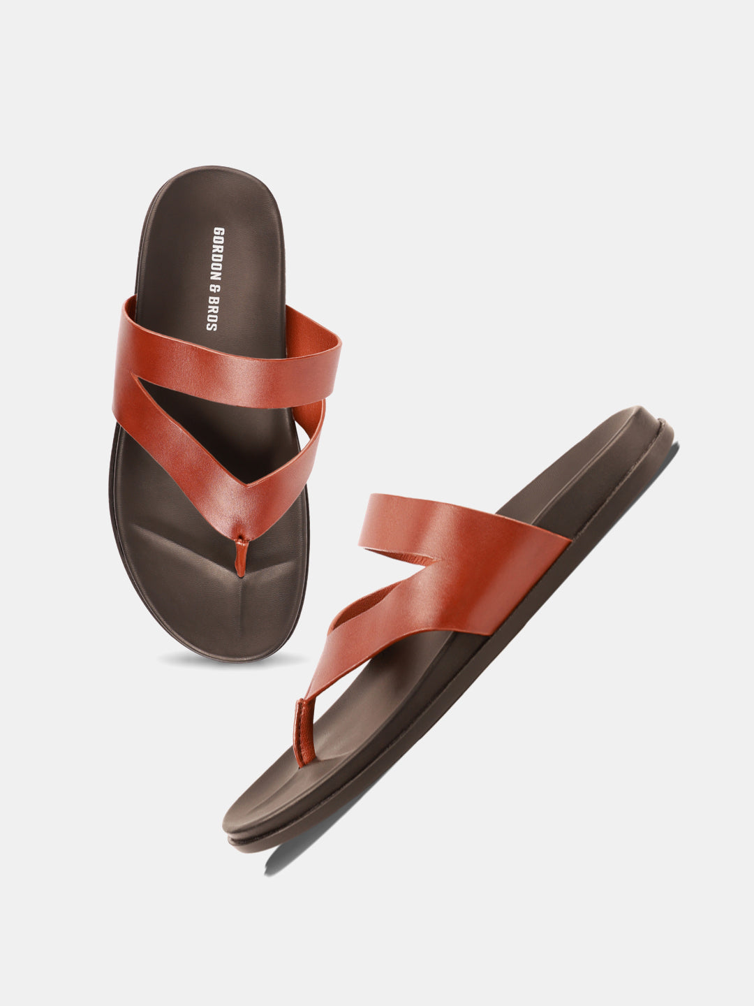 Tan sandals for men featuring a sleek leather design with a comfortable sole — with white background