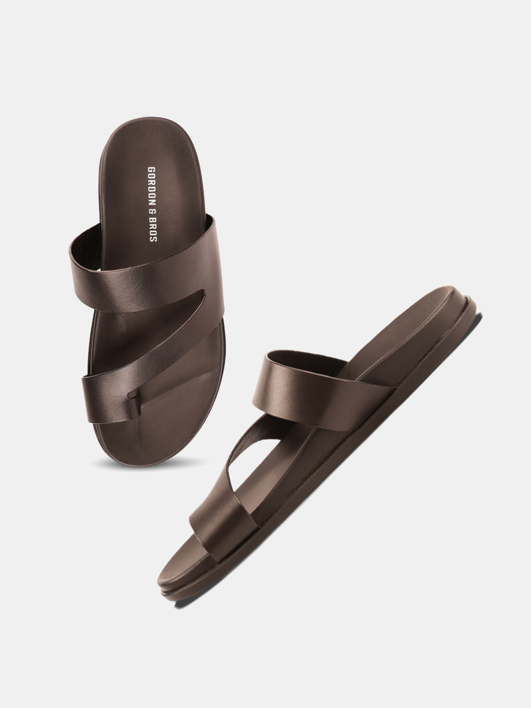 Men’s black leather sandals with slip-on crossover straps and cushioned footbed — perfect for everyday wear. WIth White Background