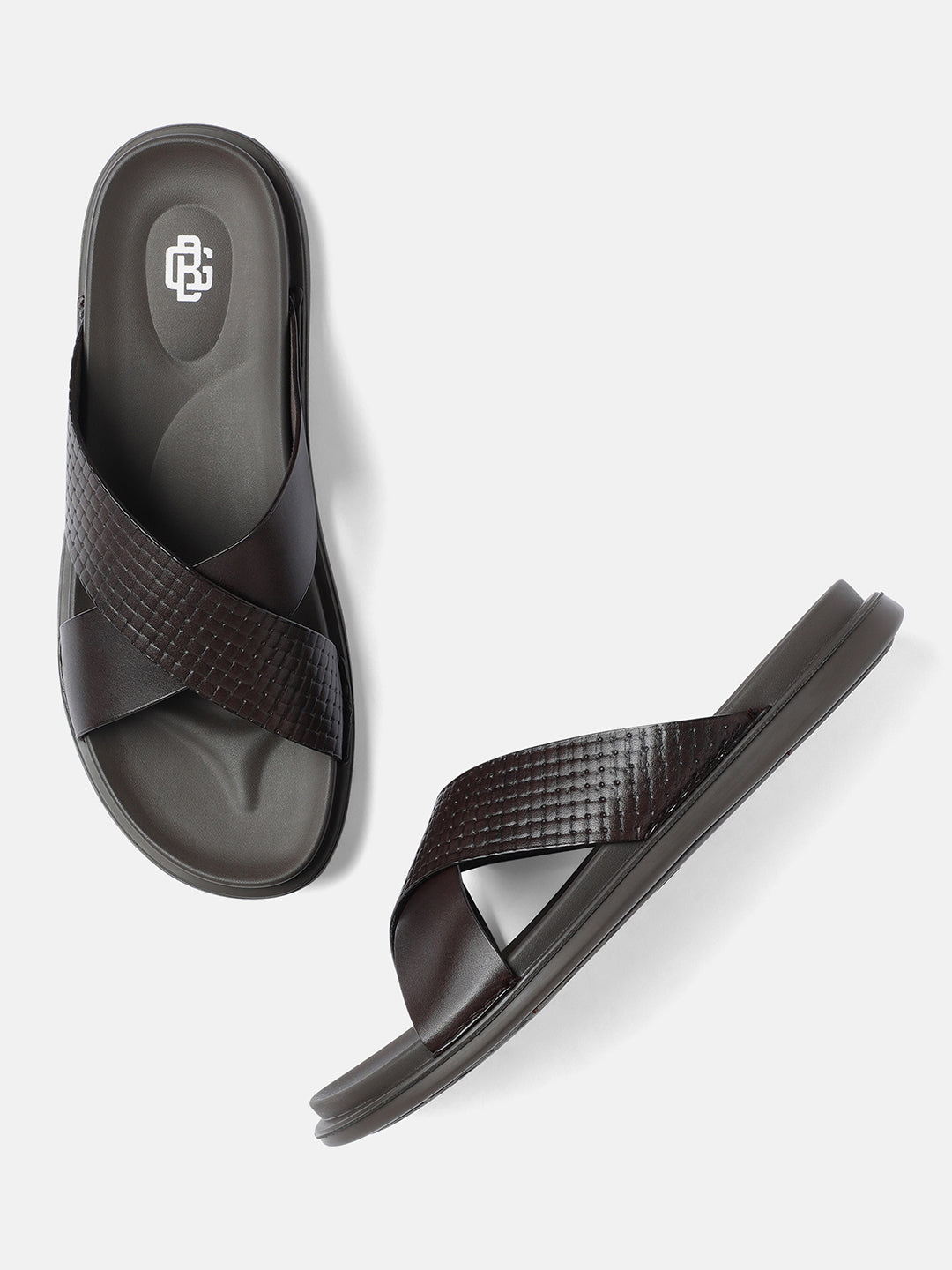 A pair of brown men's sandals with a buckle strap and textured sole.