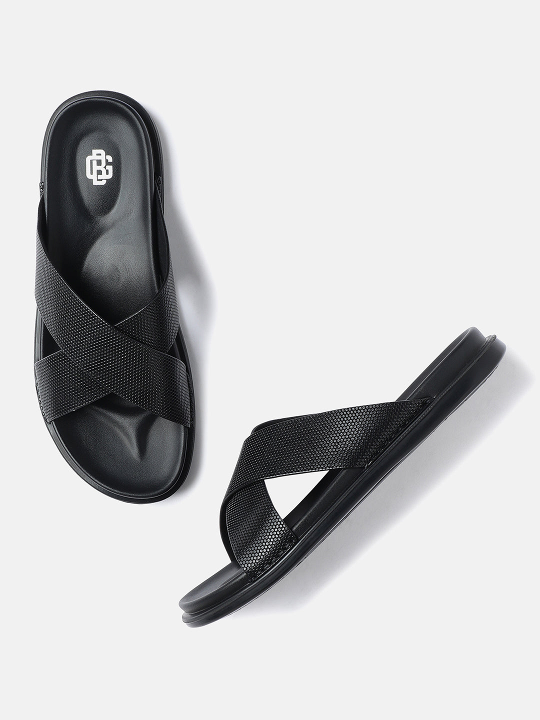 A pair of black men's leather sandals with crossed straps.