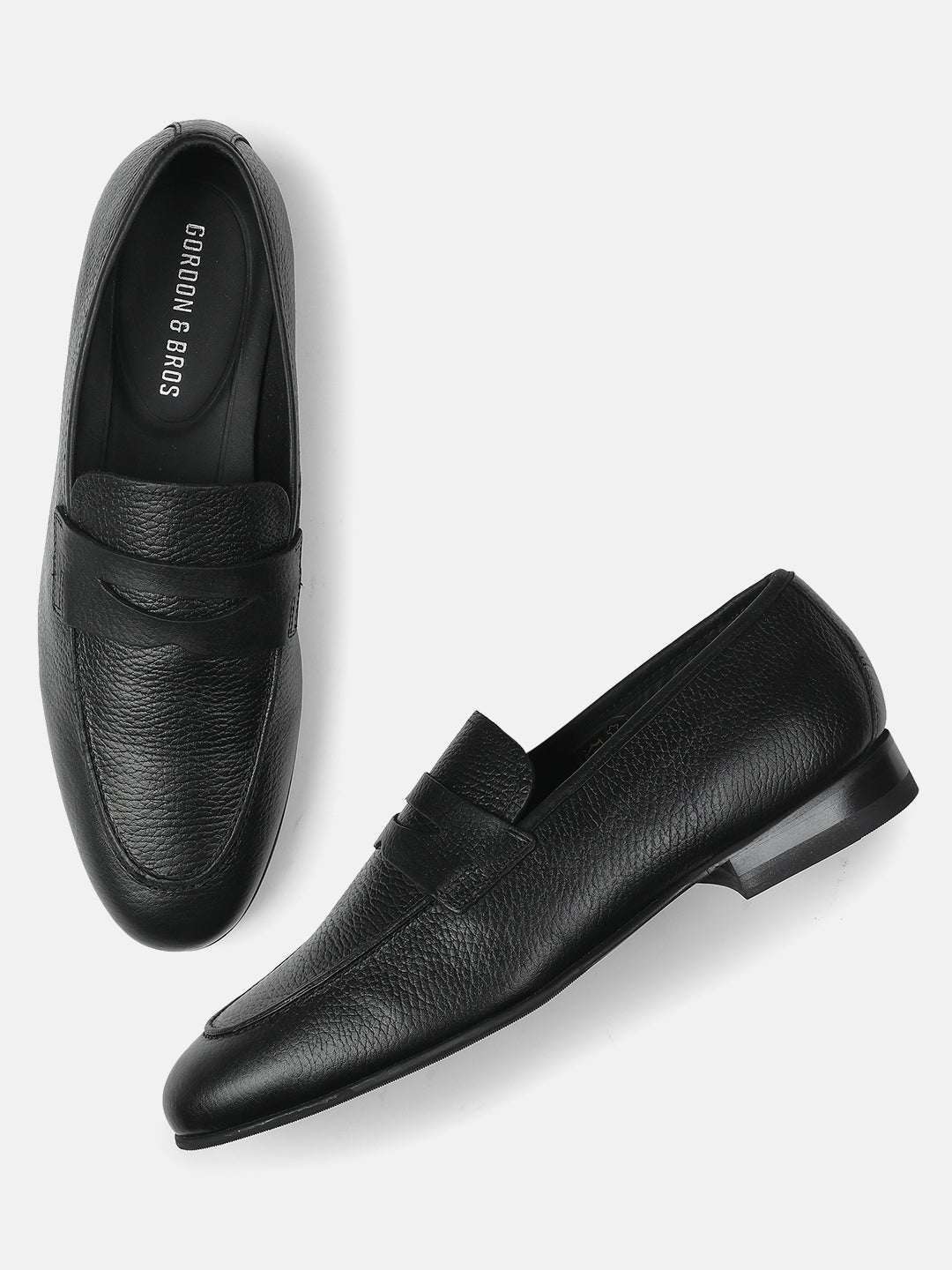 Men’s premium black loafers with textured leather finish, slip-on design, and sleek sole — stylish formal and casual footwear for men."