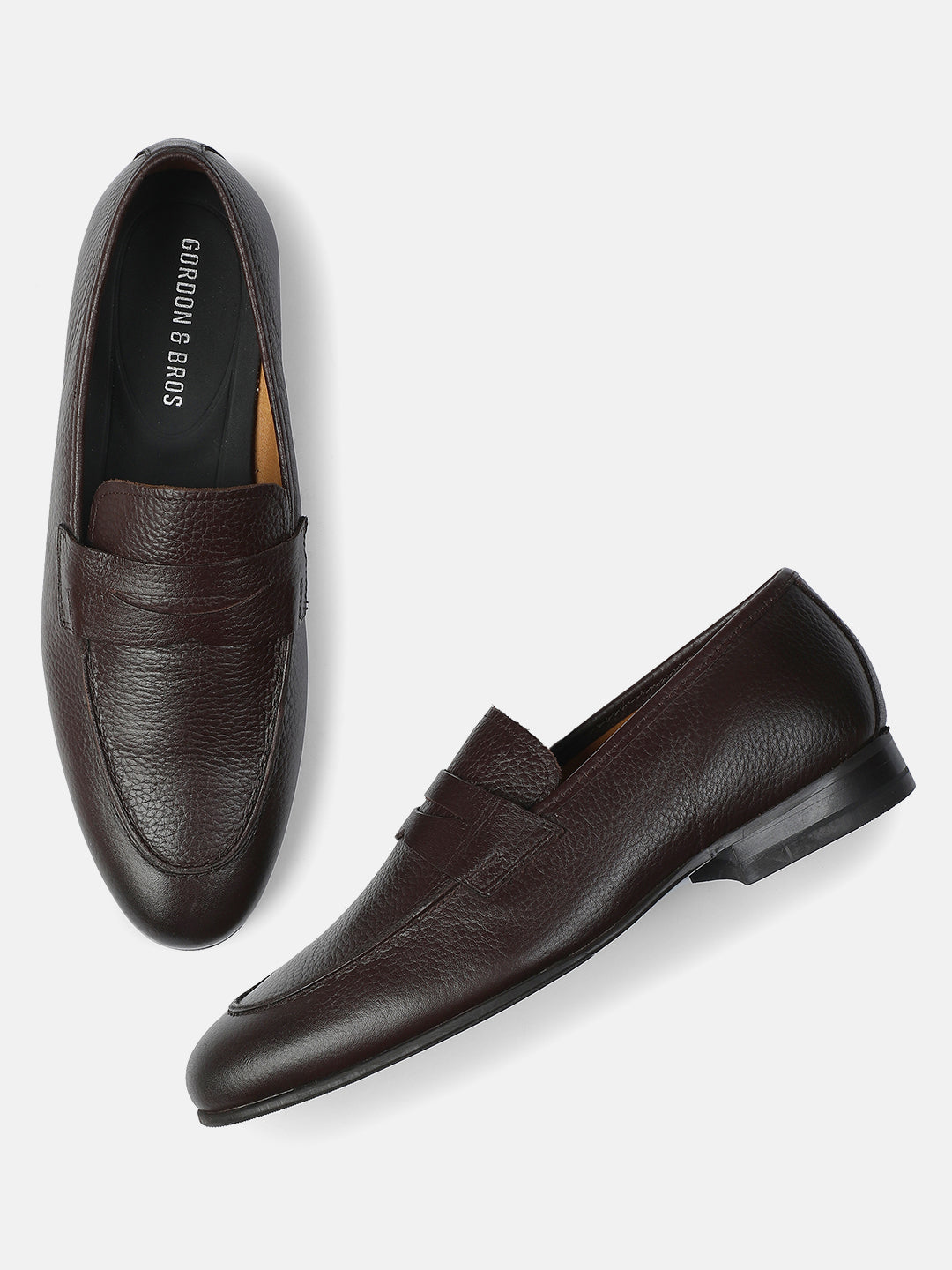 Men’s milled brown leather loafers with smooth texture and slip-on design — With background