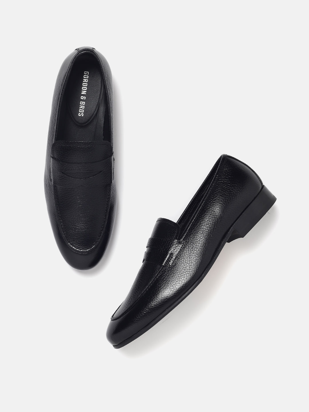 A pair of black leather loafers with a lace-up closure, displayed against a white background.
