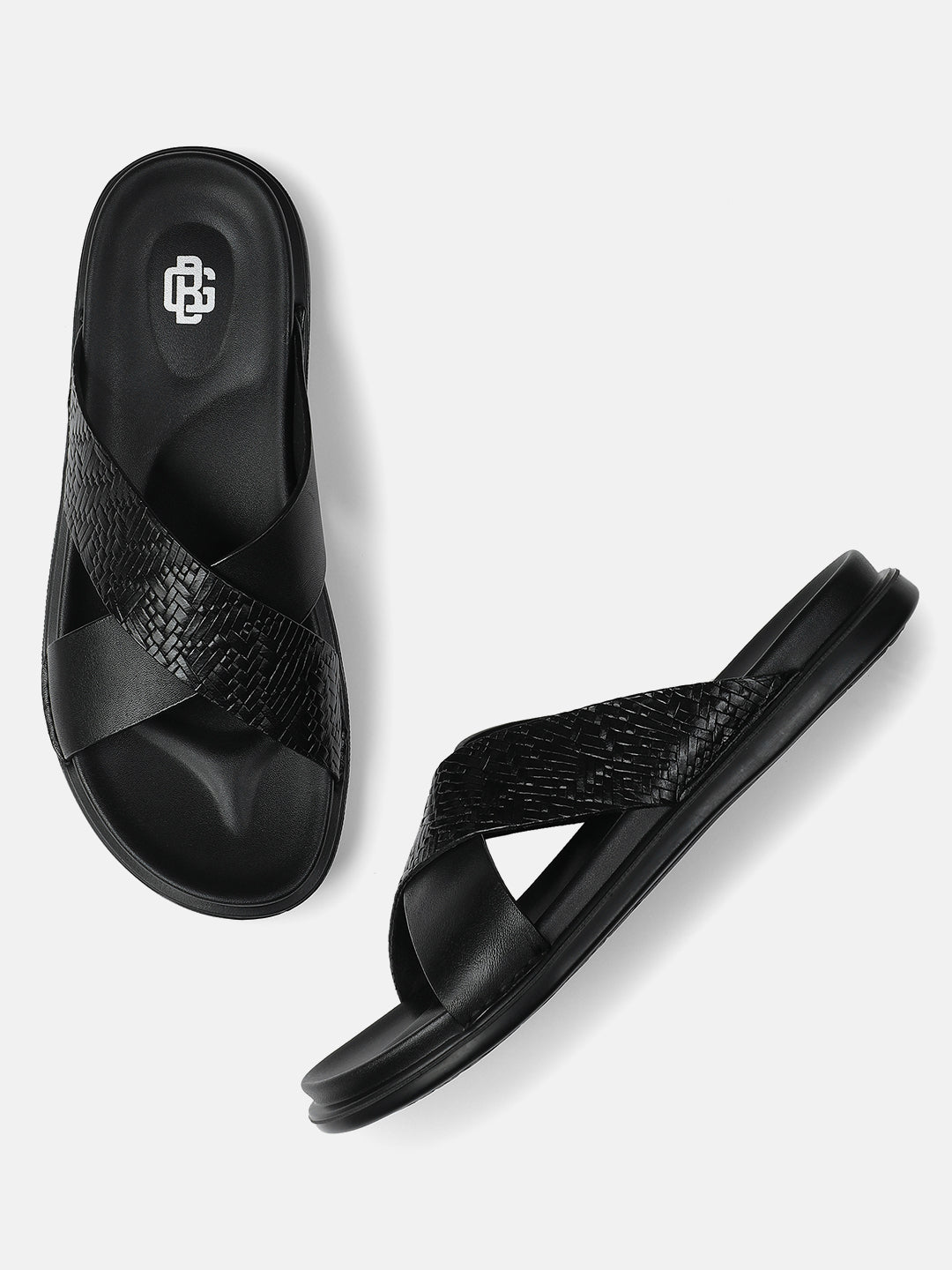 Men’s black cross-strap textured sandals with cushioned sole — with white background