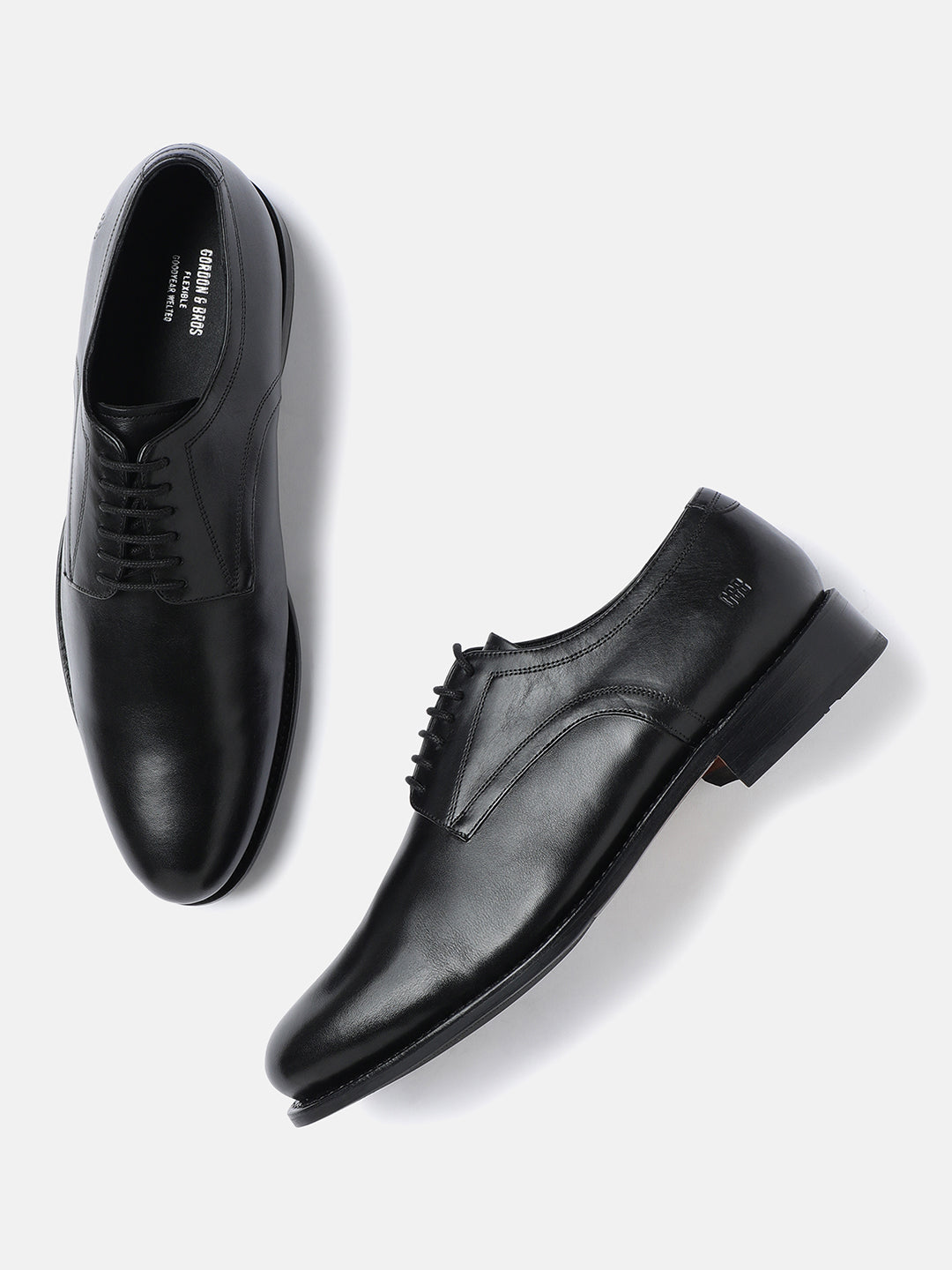 A pair of black men's plain vamp derby lace-up shoes.