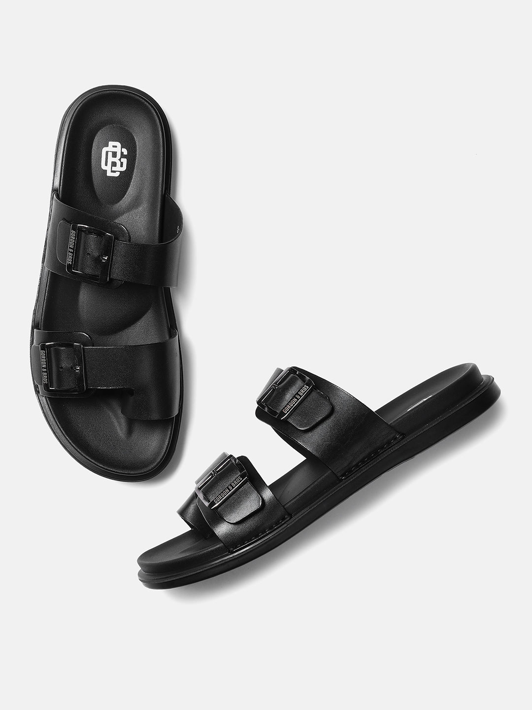 A pair of black men's sandals with adjustable straps and a hook and loop closure
