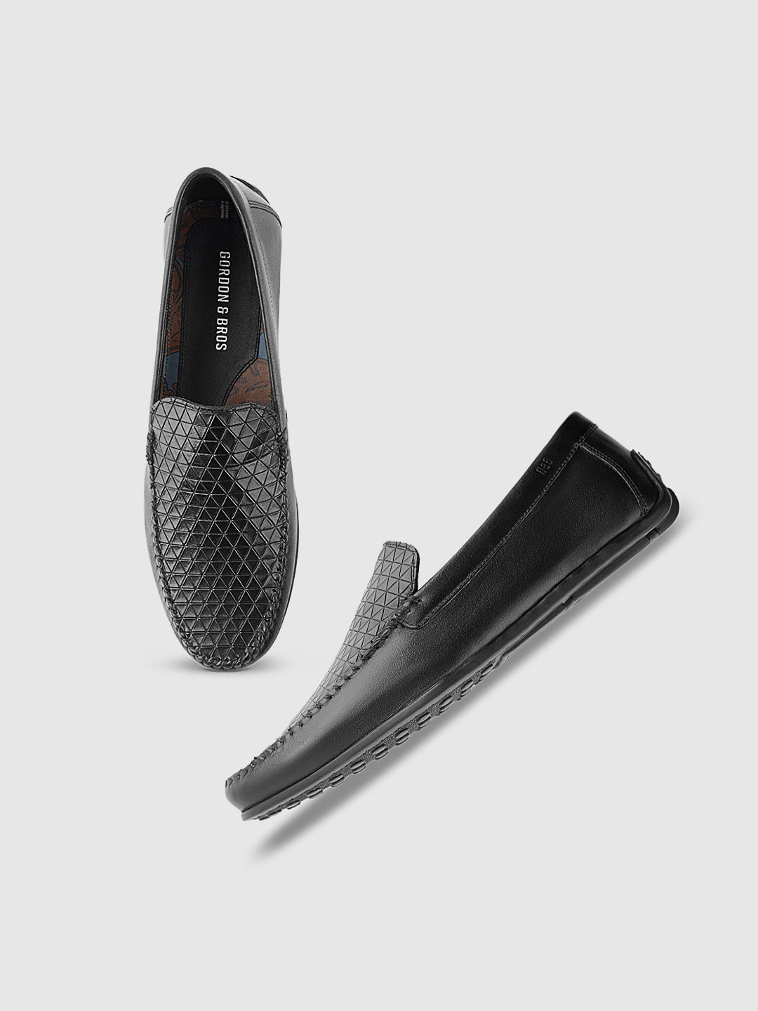 Black woven leather loafers for men with slip-on design — elegant formal footwear - With white background