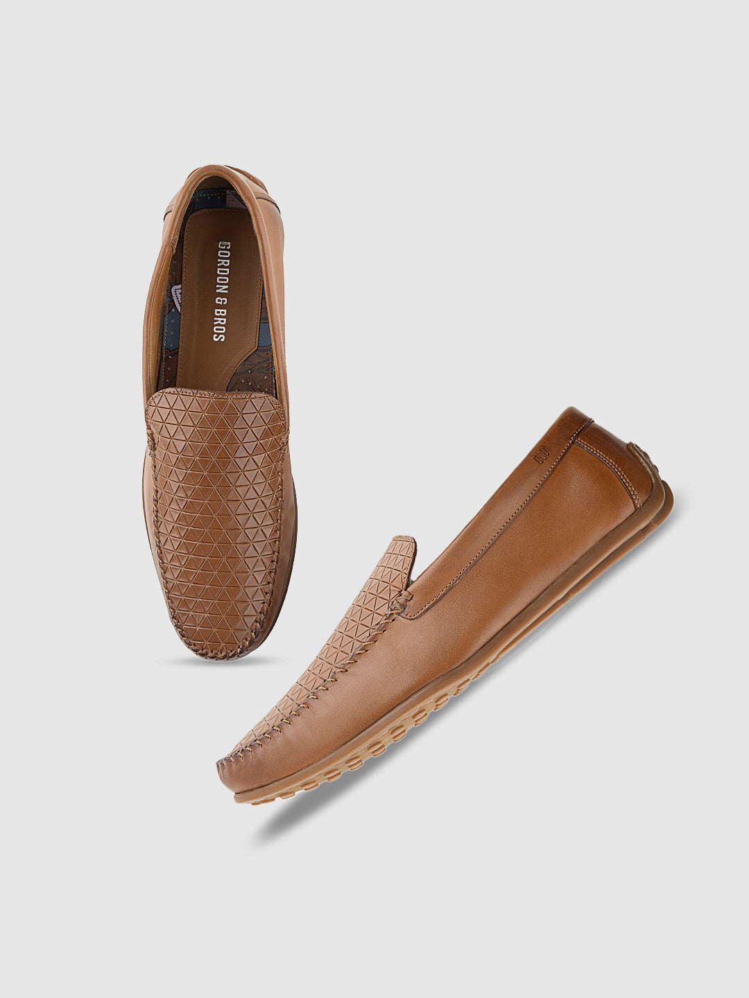 Tan woven leather loafers for men with sleek slip-on design — perfect formal footwear for office and special occasions. with white backgrounds
